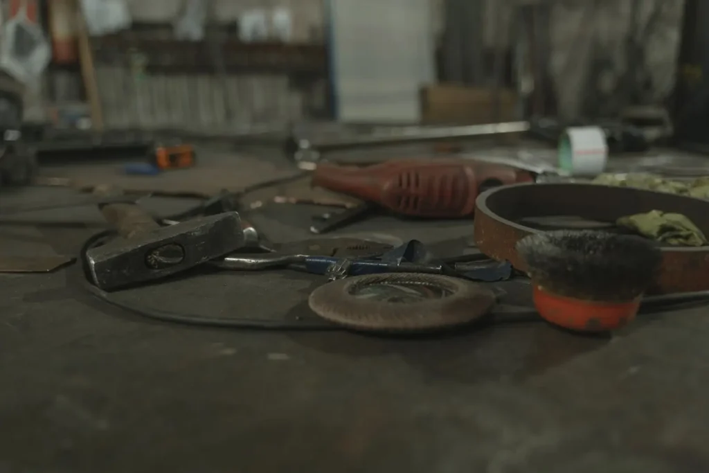 Hand tools laid out on a workbench in a training workshop