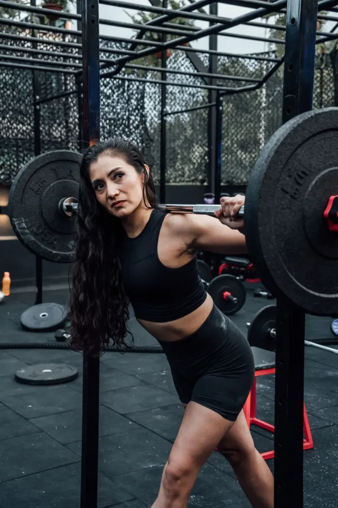 An athlete training with weights at an outdoor gym