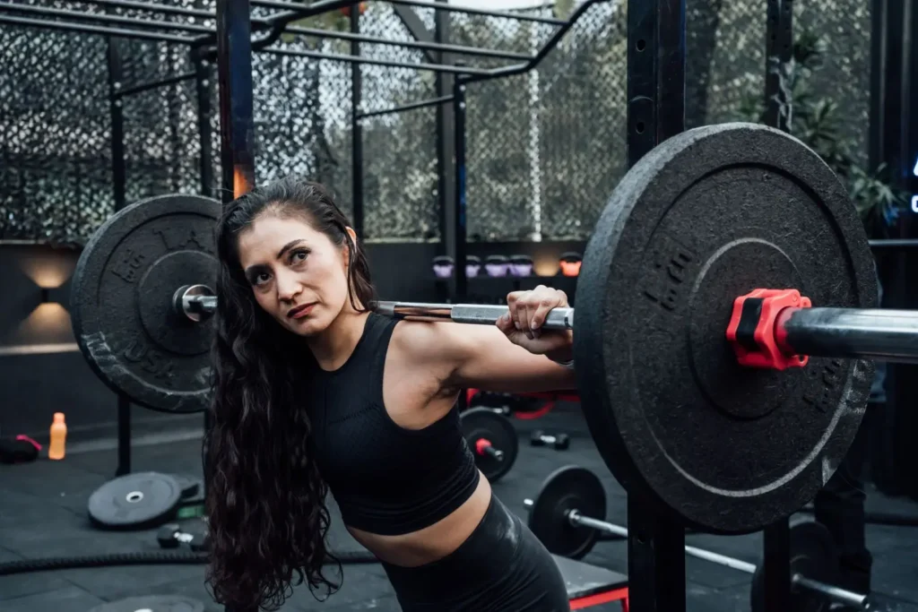 An athlete training with weights in a modern gym